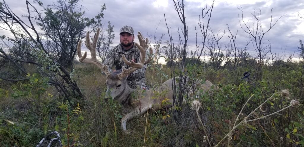 Jordan Phillip and 218-inch Saskatchewan mule deer.