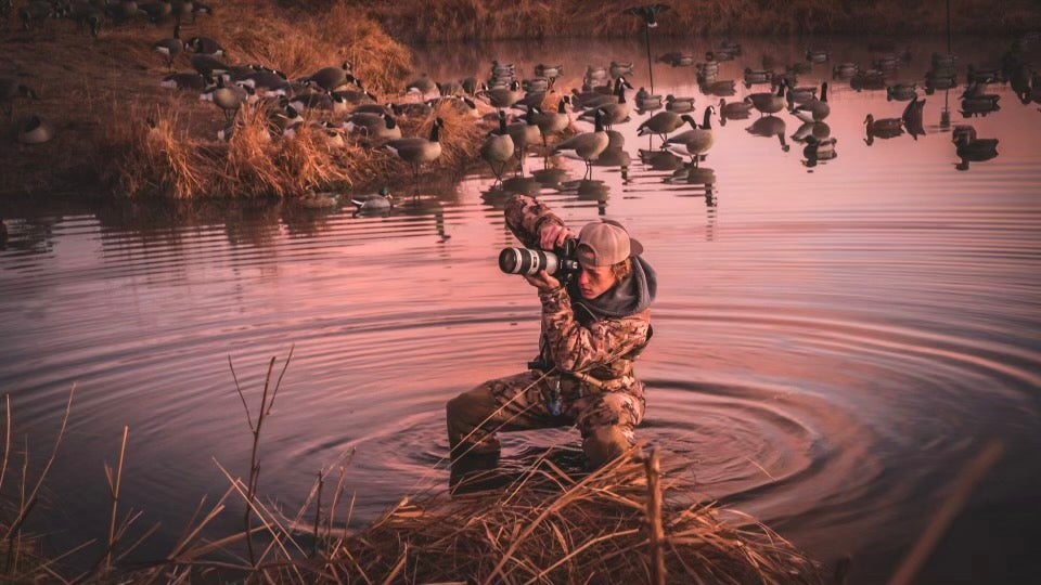 Brandon Fien in his element, shooting his 70-200mm lens in the middle of a spread of Canada geese. 