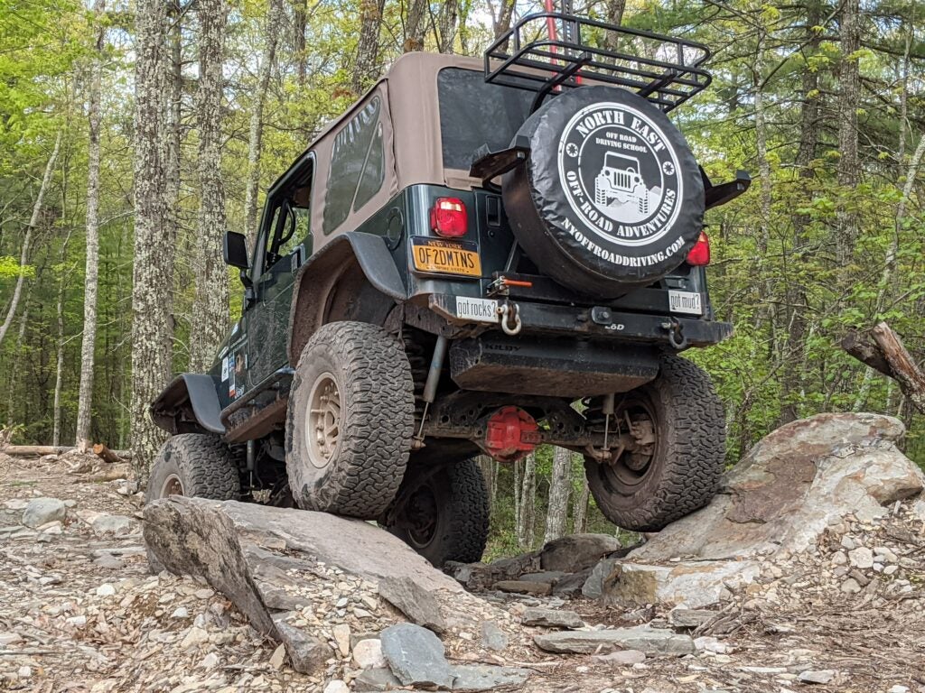 jeep off-road driving over boulders