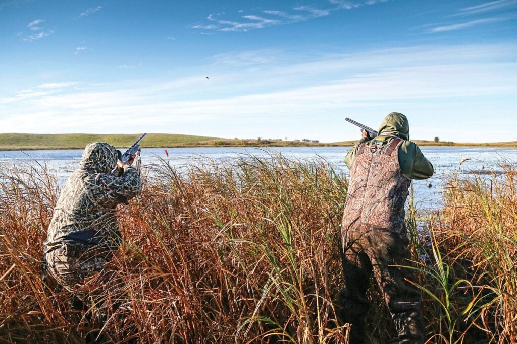 Widgeon hunters stand up for shots at ducks