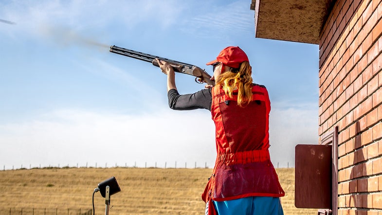 photo of woman skeet shooting