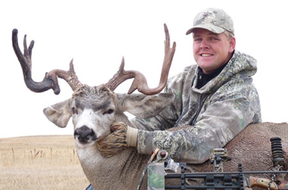 Justin Eckert with rare mule deer