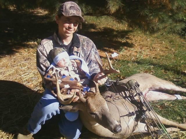 I shot this Eight point buck with my bow opening day of the 2011 season. It was my first buck with bow. It is the first deer my first son Hunter who i am holding was able to touch. What a great year it was. I also shot my first coyote that morning.