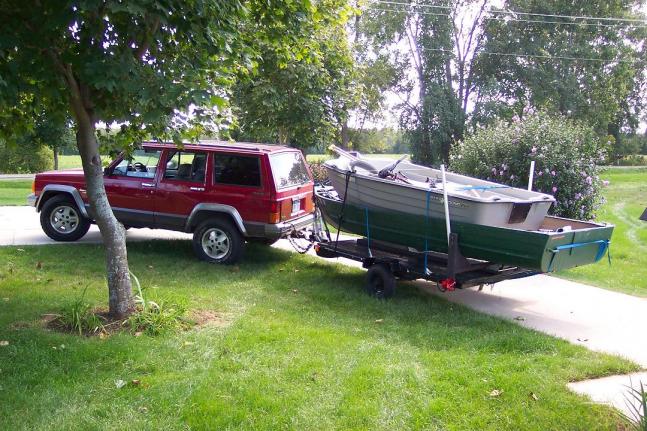 I made my 4x8' single axle trailer double as a boat trailer with a removable wood frame. On this particular trip we were headed for a camping trip/my bachelor party. We had a few people going and had to load my brothers boat inside my boat.