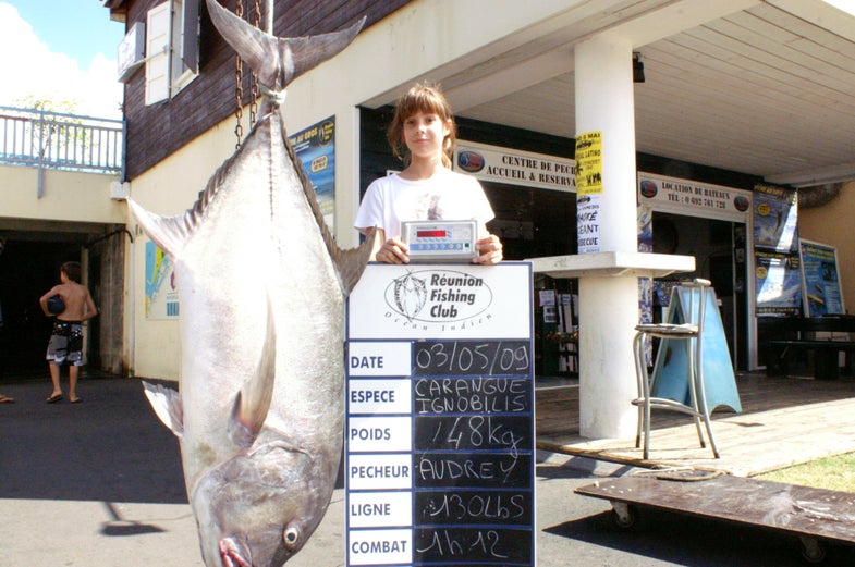 Managing to hang on during the fight for over an hour really paid off for angler Audrey Ferrand, who may overtake the 91-pound <strong>giant trevally</strong> that holds the current 130-pound line-class record in the women's division. Audrey's beast tipped the scales at 105 pounds, 13 ounces, and was caught off the remote French island of Reunion in the Indian Ocean.