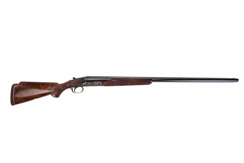 The Winchester Model 21 on a white background.