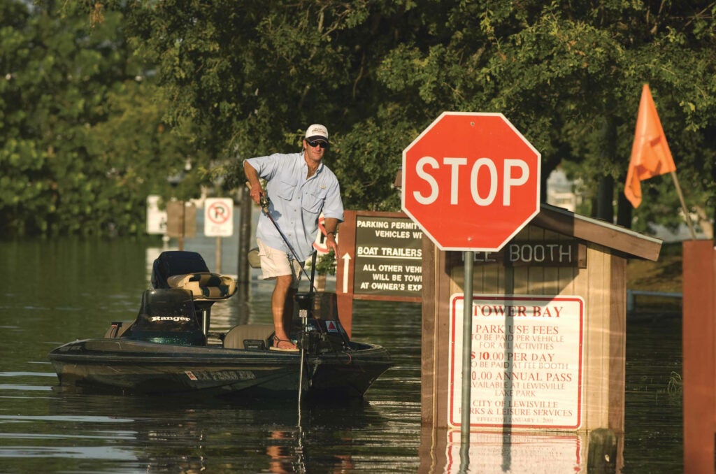 "When the lake floods, I go to heavier tackle," says Steve Schiele, shown here on Lewisville Lake last July. "It happens about every 10 years, and suddenly you're fishing chain-link fences, culverts, backyards, treetops. It's a whole different animal." Schiele, 41, guides on the lake, located just north of Dallas, and has won over 60 local tournaments. That day, he and two friends caught 15 largemouths and some 70 white bass. <strong>Location:</strong> Lewisville Lake, Texas<br />
<strong>Issue:</strong> May 2008