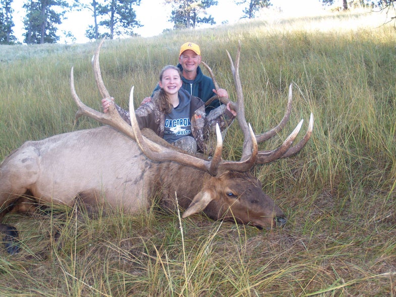 Hannah Helmer and her dad, Joel, with the possible state-record elk, <a href="http://www.omaha.com/">courtesy of Omaha World Herald</a>.