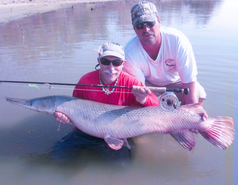<strong>Martin Arostegui<br />
Coral Gables, FL, USA<br />
Alligator Gar (Atractosteus spatula)<br />
16 lb tippet class record</strong><br />
<strong>Weight:</strong> 62 lb 8 oz<br />
<strong>The Lowdown:</strong> Fly fishing Lake Livingston, Texas, USA on August 22, 2011 with Captain Kirk Kirkland, Arostegui finally hooked up to the fish he describes as "the fish of 10,000 casts" - a 28.35 kg (62 lb 8 oz) alligator gar. Thirty minutes after the fish struck, Arostegui was able to land, weigh and release the fish alive. The current IGFA record is 11.25 kg (24 lb 13 oz).<br />
<strong>Bait Used:</strong> Custom fly