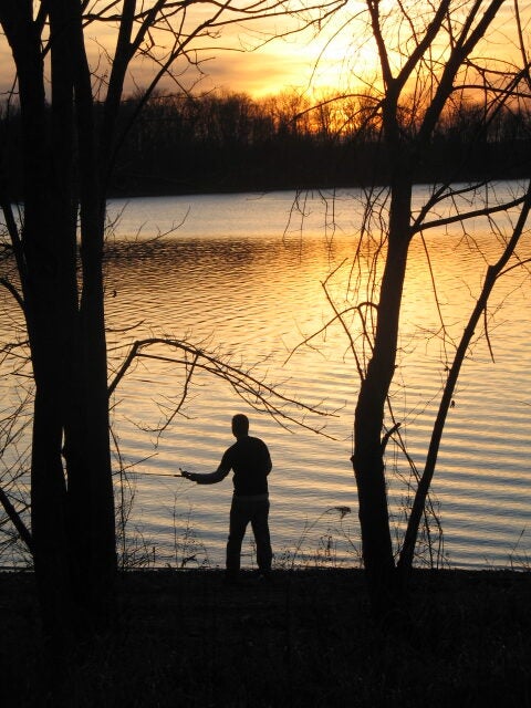 This was the night we got to Kentucky Lake to begin our camping and fishing trip. We had just finished setting up camp and wanted to get in a couple of casts before the sun went down. My wife ended up capturing this awesome shot of me casting out into the lake.