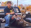 Hunting from the ground with his new Hoyt Katera, 15 yr old Dustin Smith released an arrow and a 15 yd shot dropped this 11 pt within 40 yds