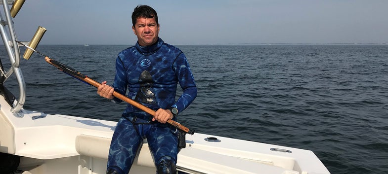 yuri krainov spearfisher sittin on boat