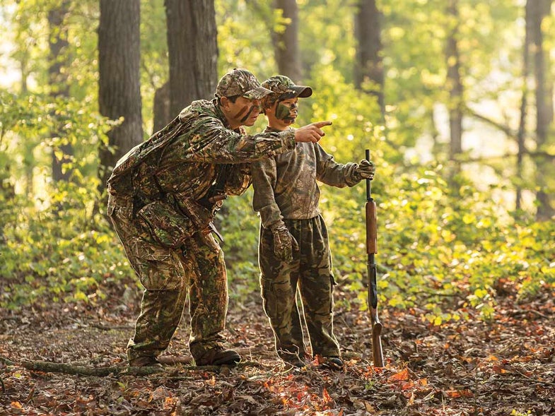 father teaching son hunting lessons