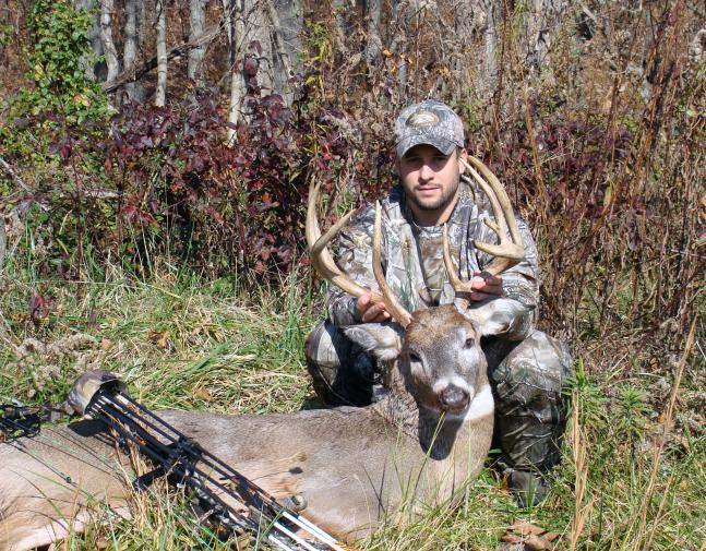 A photo of Scott my son in law,with a 140 class deer. Scott has shoot alot of nice deer mostly with his bow.