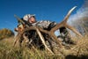 Bowhunter Drew Stoecklein reclines on a 6x6 elk rack after a full day of hunting solo and hours of packing the bull from Gallatin National Forest. Stoecklein called photographer Dusan Smetana to help make two trips to his car, 4 miles away. "Drew got a nice trophy bull," says Smetana, "but it was so much work to pack it out." The pair transported at least 300 pounds of meat and the 100-pound rack down steep, uneven terrain. "When you carry that much for that long, you get lazy enough to lie down with the whole bag," he says.<br />
<strong>Location:</strong> Bozeman, Montana<br />
<strong>Issue:</strong> September, 2010<br />
<em>Photo by Dusan Smetana</em>