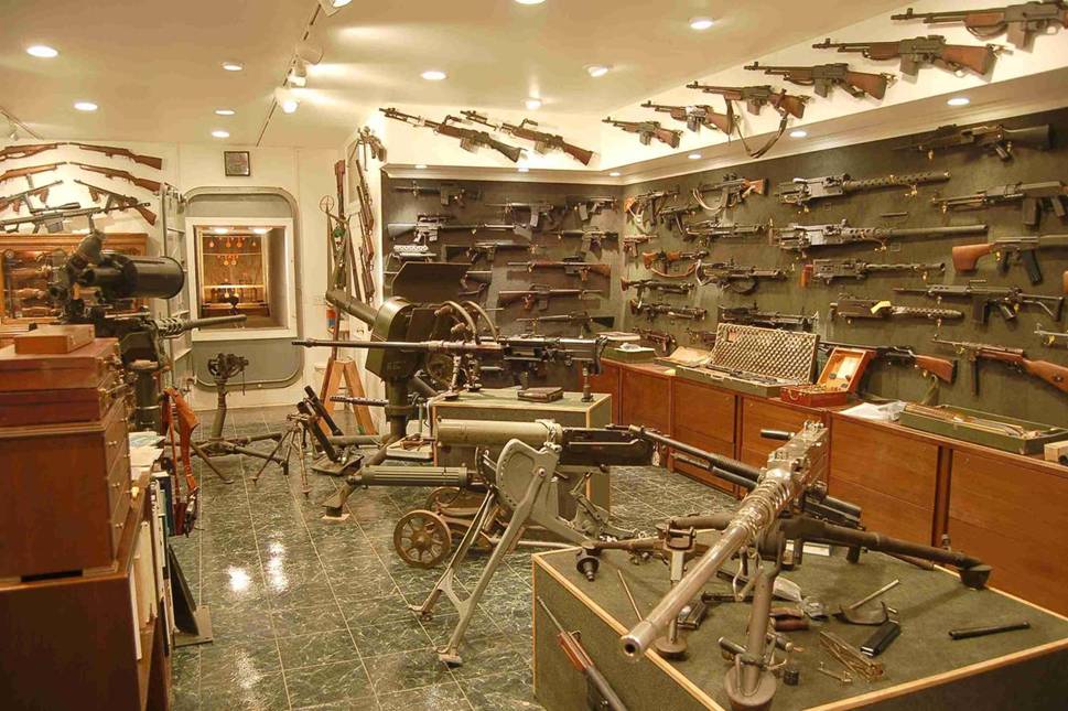 <strong>Charleton Heston's Gun Collection</strong> One of a series of snapshots that show the impressive gunroom of Charlton Heston, reportedly located in the basement of the actor's house. Burglar beware. True or false?