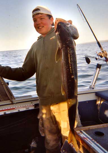 Ryan Voss, 12, caught this 34-inch, 9-pound laker while fishing with his father on Lake Superior.
