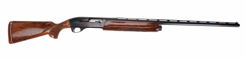 The Remington Model 1100 on a white background.
