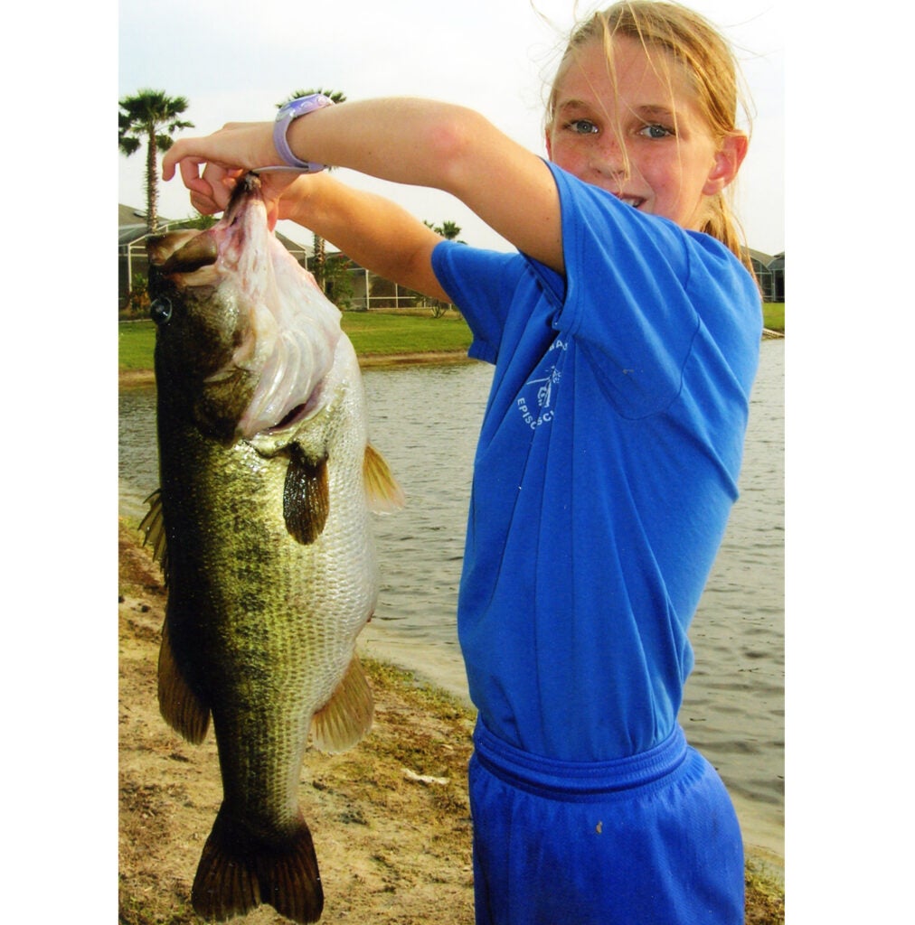 girl holding a big fish. 