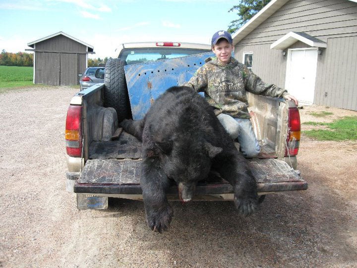 <strong>On a muddy Saturday morning</strong>, third generation bear hunter Braden Burkhart, 11, of Antigo, Wisconsin headed out with his grandfather, Ken Rine, his father Larry Burkhart, his younger brother Mason, their dogs and a group of friends, never imagining that he'd be the one, out of a bear hunting freaternity with more than 100 years of combined experience, to come home with a record-setting trophy. The bear season in Wisconsin alternates each year, allowing hunters with dogs and bait hunters to take turns for the first crack at the state's black bear population.