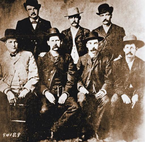 <strong>Number Three: Luke Short vs. Longhair Jim Courtwright</strong><br />
<em>(February 8, 1887, Main St., Forth Worth, TX.)</em><br />
Most gunfights took place at extreme close range, and this one is typical. Both men were gunfighters, and quarreled over Courtwright's protection racket. They fought almost at arm's length. Short fired first, cutting off Courtwright's thumb. Courtwright, unable to cock his pistol, reacted with extraordinary coolness, throwing his gun to his other hand in what was known as "the border shift." It didn't help. Short shot again and killed him. <em>Picture: The Dodge City Peace Commission. Short is in the top row, far right. Can you identify any other famous figures in this photo?</em>