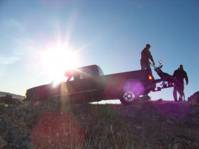 Loading up a mule deer after a successful morning hunt. Backed the chevy right up on the rocks to load it up.