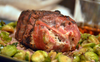 A venison backstrap recipe that features meat stuffed with crab meat on top of brussels sprouts