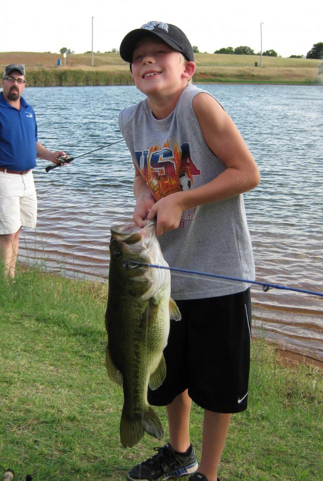 My 8 year old son Zach, landed this 7lb. 9oz. largemouth at a public fishing hole in our city park on 7/23/2011.
