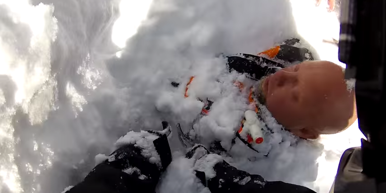 Video: Helmet-Cam Footage of Snowmobiler Buried by Avalanche and Rescued