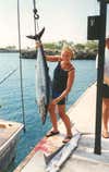 Diana caught this 50 pound, 5' 6" wahoo while trolling a mackerel off of Hawaii's Big Island. It took her an hour to land the brute.