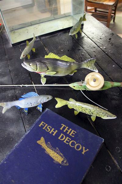 <strong>Carved wooden fish decoys</strong> have long been used by ice fishermen, packing spears rather than rods, to lure in lunkers on the hardwater. Dave Kober is a fifth generation decoy carver from Cadillac Michigan and makes each deke with painstaking detail. Here's a look at some of Kober's greatest work and a little bit about a man who averages 10 hours on just one decoy.