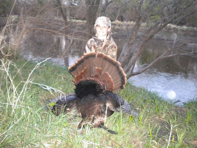 My niece Ally nailed her first turkey. It took a few shots but she got it done. He had a 10.5 inch beard, weighed 21 pounds and had .75 inch spurs.....a nice 2 year old bird.