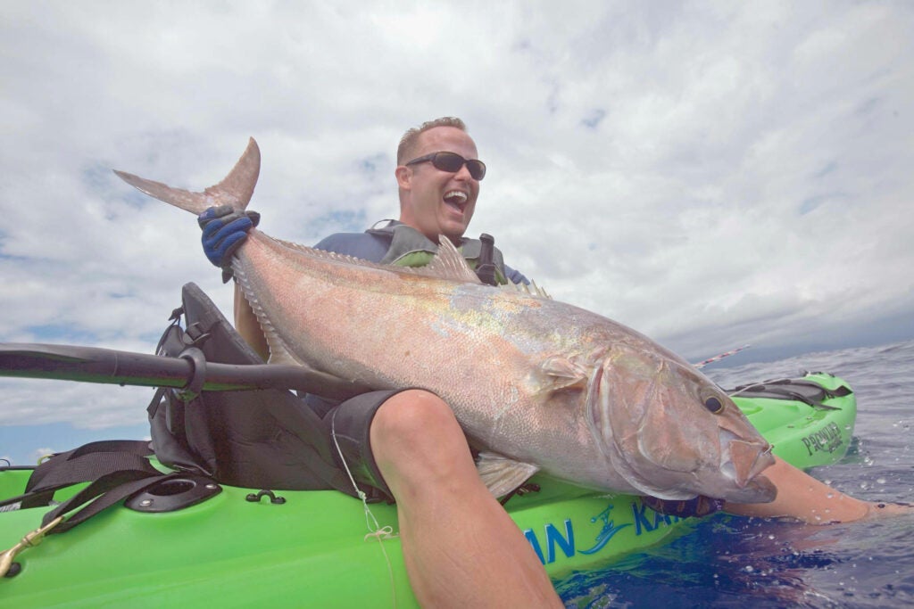 "Hooking an amberjack is like catching a car on a freeway 400 feet down," says Jon Schwartz, holding a 40-pounder off the Hawaiian coast last July. Schwartz pursues everything from marlin to tuna to tiger sharks from a kayak (this one is only 121⁄2 feet long), using custom rods and 80-pound-test braided lines. "In a 'yak, it's just you and the fish. It's primordial. And I want the biggest monsters possible." <strong>Location:</strong> Kona Coast, Hawaii<br />
<strong>Issue:</strong> June 2008