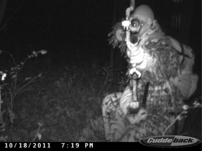 Creepy shot of a guy in front of my trail camera....