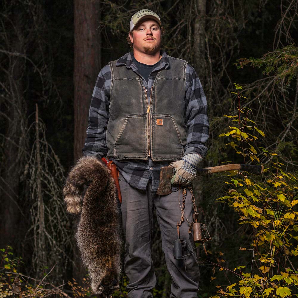 justin lemmen in the woods with animal pelt