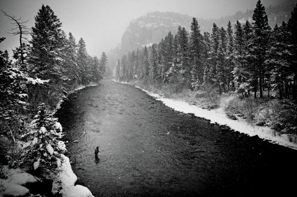 "It was just warm enough that the rod wasn't freezing--one of those perfect Montana days," says fishing guide Greg Bricker of this snowy March afternoon on the Gallatin River. "The snow wasn't even blowing. It was such a weird effect." The Gal-la-tin was a more picturesque stand-in for the Blackfoot River in the film A River Runs Through It, and the scenery didn't disappoint Bricker. "Nobody had been down there and everything was fresh." Bricker says the fish were plenty cooperative, too. He caught half a dozen rainbows and only retired once 8 to 10 inches of snow had accumulated. "You go out when you can in winter, but you don't get many days like that one."<br />
<strong>Location:</strong> Big Sky, Montana<br />
<strong>Issue:</strong> February, 2011<br />
<em>Photo by Brian Grossenbacher</em>