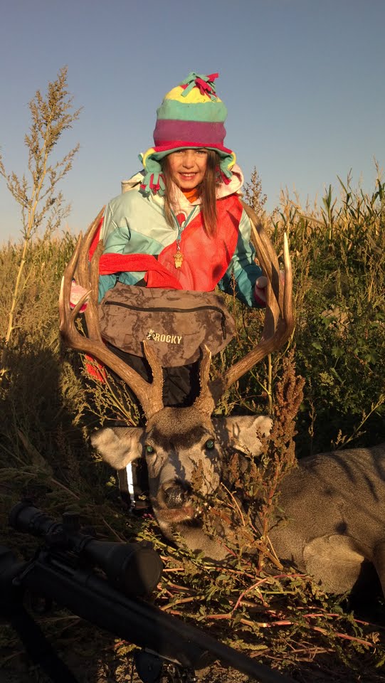 I took my 4 year old on her first hunting trip with me to my uncle's farm in Goshen County Wyoming. I took her out in her winter coat, orange vest, and pink ear muffs. The very first morning this 13 point mule deer walked up the field we were watching. Hannah was very excited that we got a deer, and kept asking to have it mounted in her room. It is going in the living room.