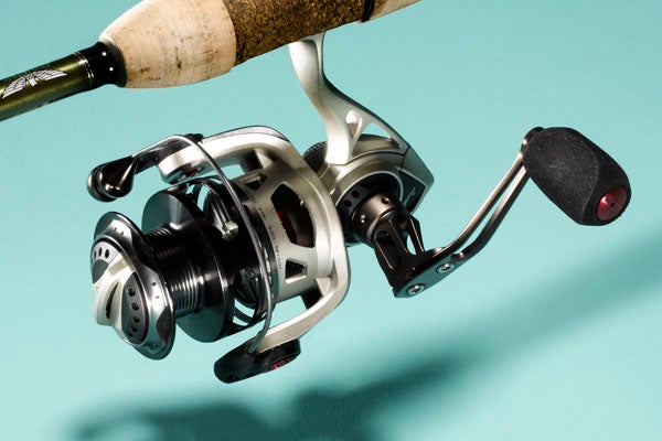 Odd looks and a light overall weight signify a very innovative and functional new spinning design. Quantum's Exo concept reduces weight wherever possible by way of a minimalist exoskeleton. Our 25-series sample weighs a paltry 6.9 ounces, roughly 25 percent lighter than most comparable reels. A uniquely offset handle noticeably reduces the wobble felt when cranking, which can be a problem with all spinning reels. The stainless-steel, ceramic, and carbon drag system feels smooth as a baby's bottom. The futuristic-looking reel frame is aluminum; the reel's rotor is of an advanced composite. There are two sizes: the 25 and a slightly larger 30. The 25 has 5.2:1 gears and carries 150 yards of 8-​pound mono. The 30 has the same gear ratio and takes 150 yards of 10-pound. --_JM Manufacturer:_ <a href="http://www.quantumfishing.com/">Quantum</a>_<br />
Price:_ $200__