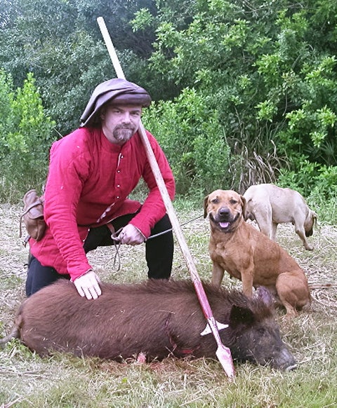 Here's Richard Swinney, of Nixa, Missouri, who portrays a 15th century minor noble, with a wild boar he took with a spear in Okeechobee, Florida. Nobles often wore brighter, more colorful clothes (dyeing fabric bright colors was costly) rather than the muted wools of huntsmen and foresters.