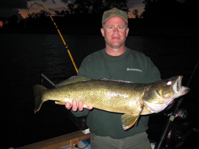 My cousin Bob Mirkle and I were trolling the Muskegon channel back to the dock, when this hog of a walleye hit a green scaly J plug. We couldn't believe it. It was an awesome way to end a day of salmon fishing. Bob always finds a way to put fish in the boat.