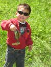 Andrew Schnautz (3 ½ years old) came to visit me, his Uncle John in Virginia. We went to the neighbor’s farm pond for Andrew’s first fishing trip. Andrew’s first fish was this nice little brim. He kissed it and released it back into the pond.