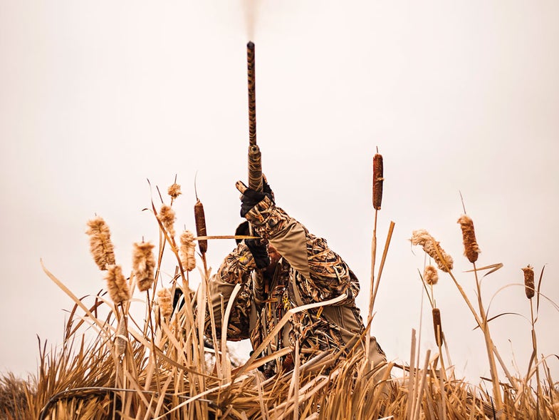 Custom-shop hunter shooting in a field
