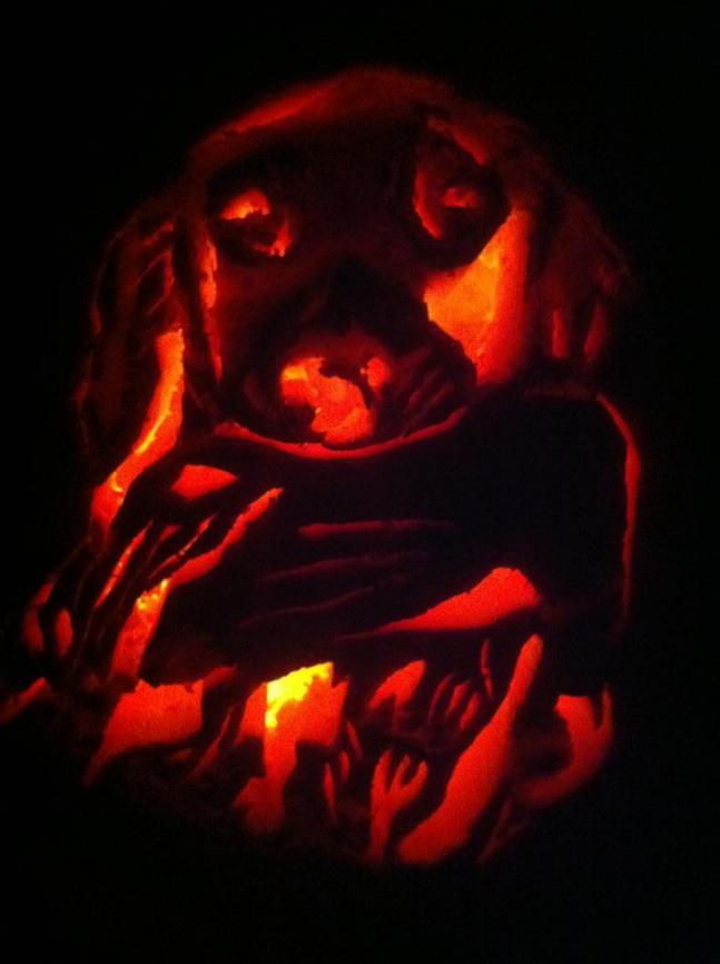 I've been training my Golden Retriever Buddy for duck season this year. I carved this pumpkin of him yesterday - he is holding a duck in his mouth. Hope you like it!