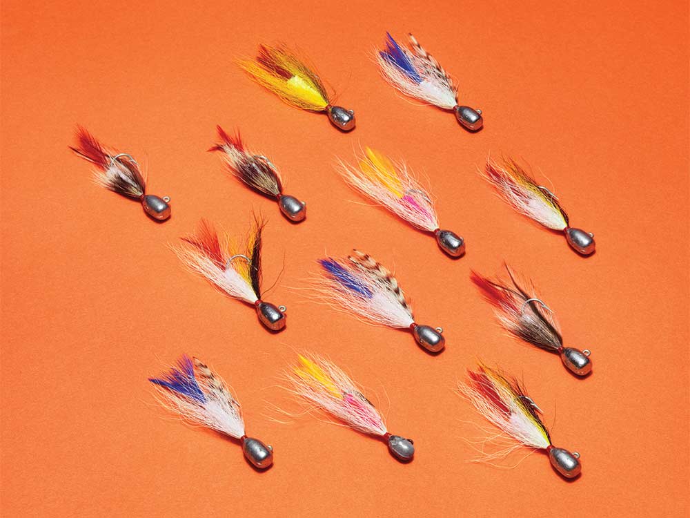 fly lures on an orange background