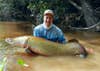 male angler holding a south american arapaima