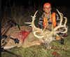 hunter with a giant whitetail buck