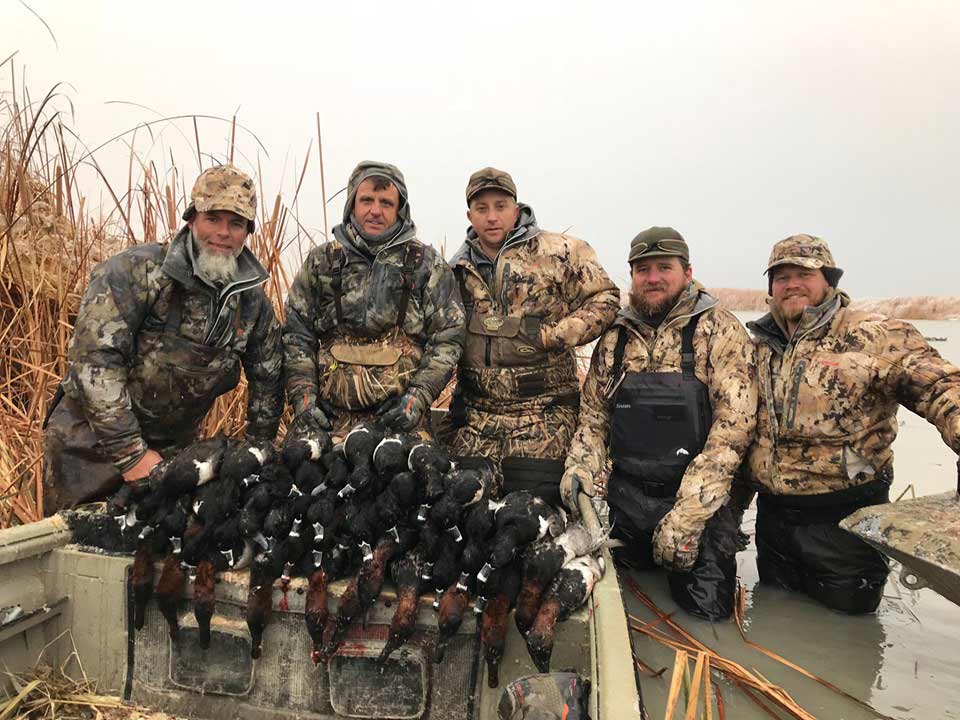 5 hunters hunting waterfowl