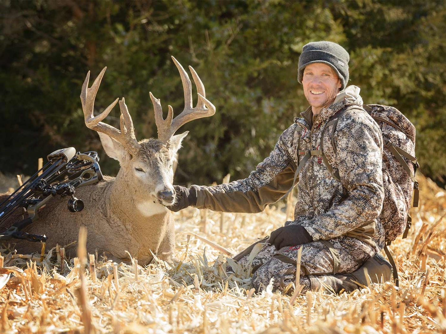a hunter and a Nebraska buck taken in an alfalfa field.