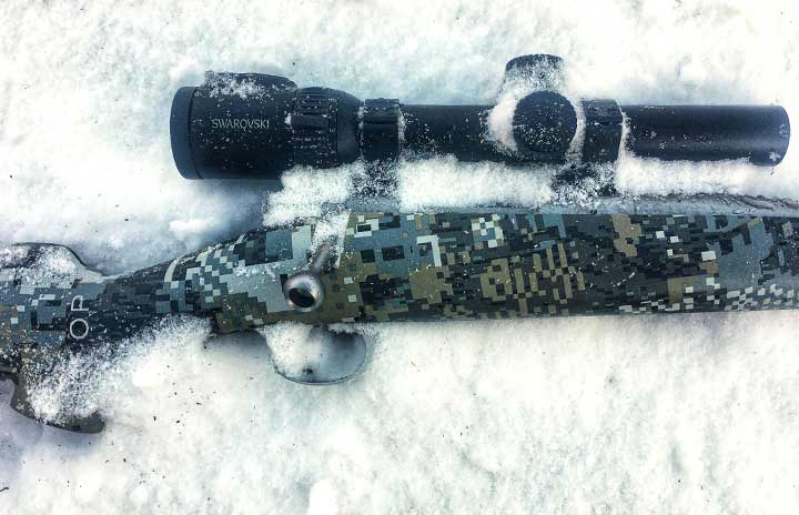 Opener Photo Caption: With a synthetic stock, stainless barrel, and quality scope, this Kimber Adirondack is set up to handle bad weather.