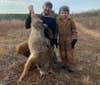 Author and son trapping a coyote.
